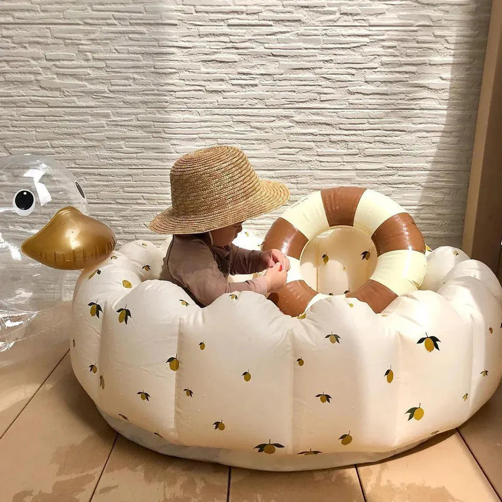 Baby enjoying BubbleBub™ bear petal pool, safe & fun play