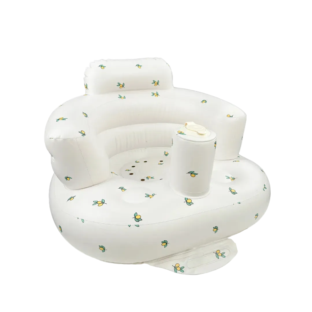 White inflatable chair with floral patterns on a white background