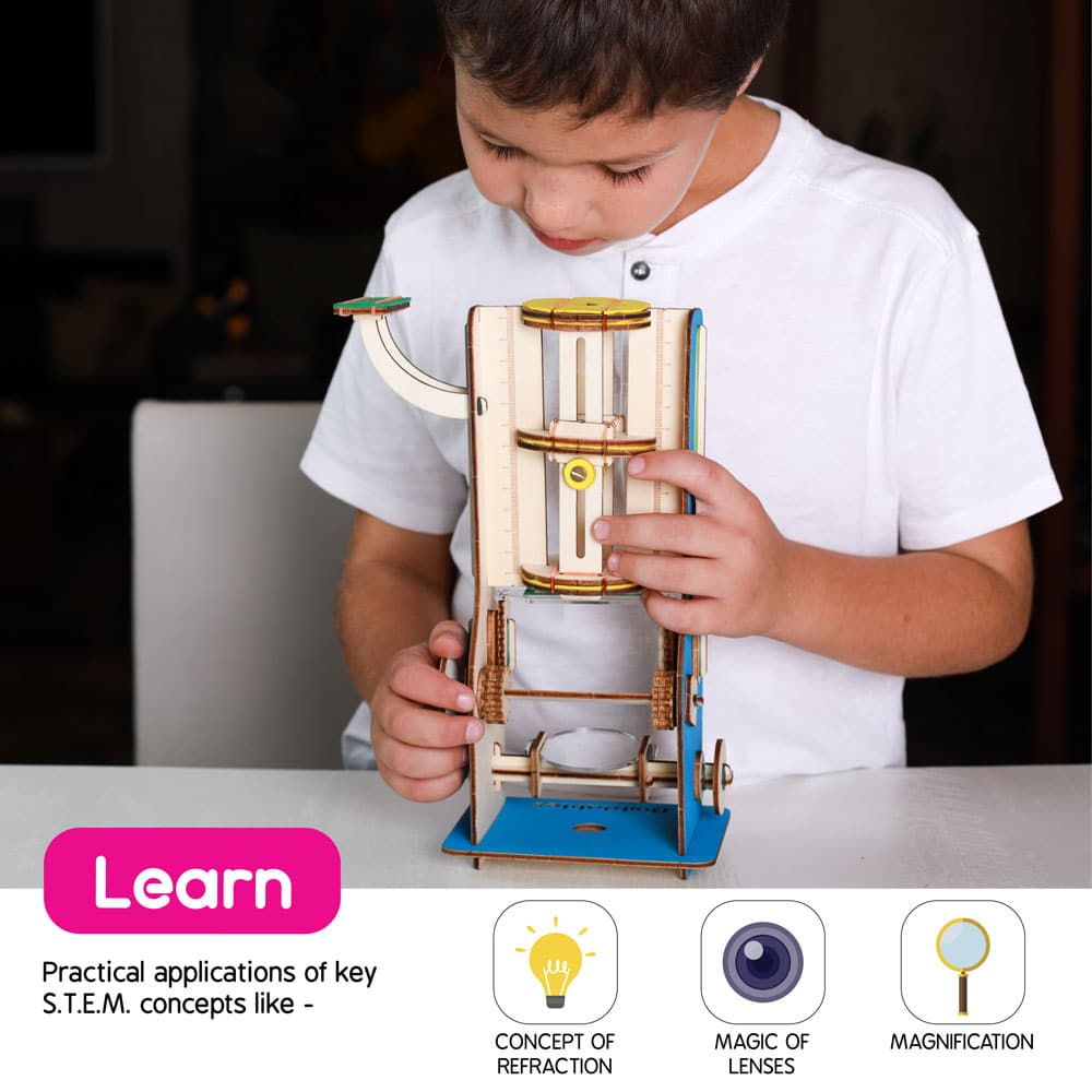 Boy looking through the buildable compound microscope — discovering specimens and learning science concepts