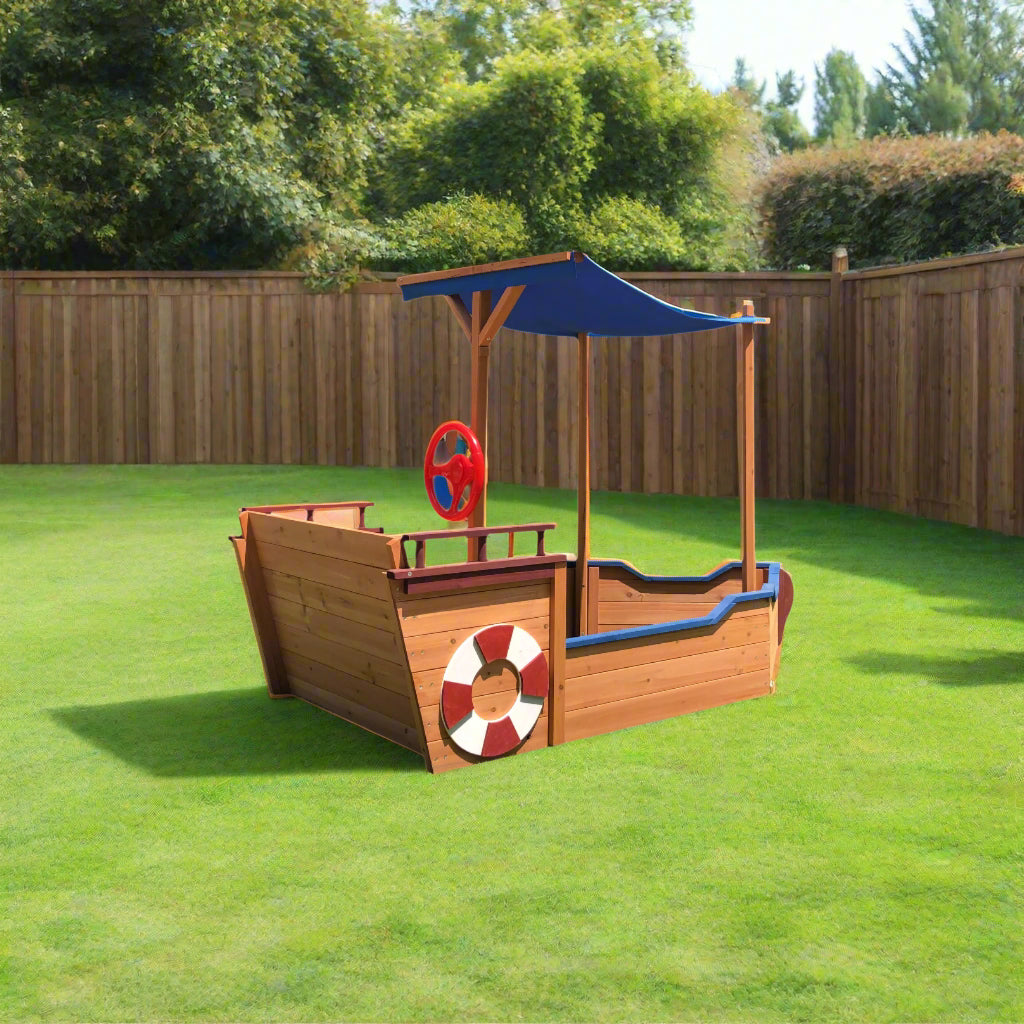 Detail of nautical-themed decorations – lifebuoy and rudder on sandbox