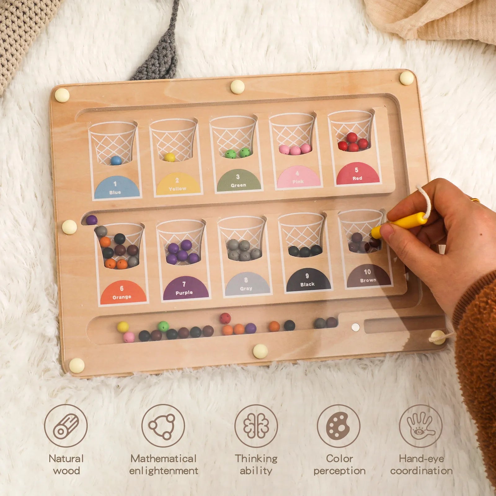 Toddler manipulating magnetic beads with a wand — Magnetic Color & Number Maze for preschool classrooms in Europe