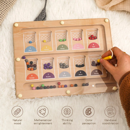Toddler manipulating magnetic beads with a wand — Magnetic Color & Number Maze for preschool classrooms in Europe